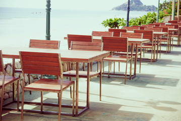 Restaurant table with sea beach background , relax place for eating
