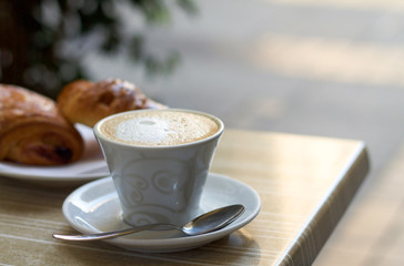cappuccino cup with milk cream
