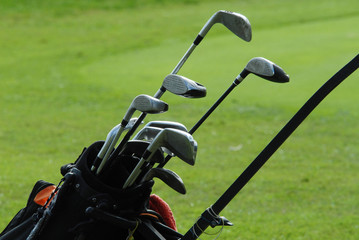 Golf Clubs green , bag on the  fairway