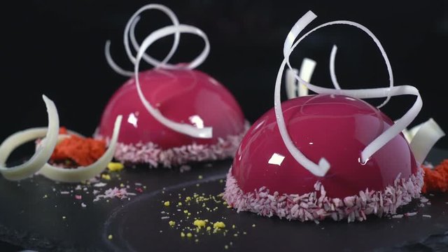 The cake in the glaze, decorated with white chocolate