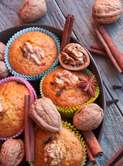 Obraz na płótnie Canvas Muffins with walnuts and cinnamon