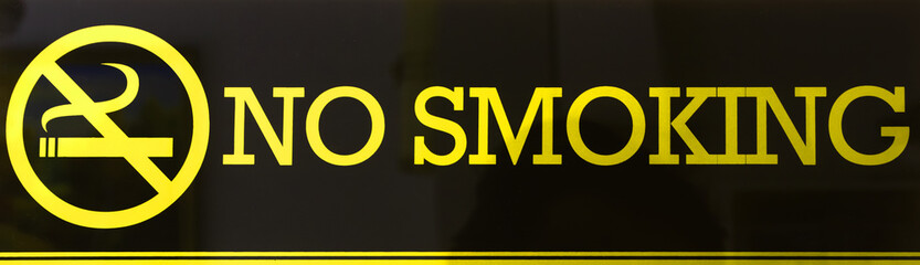 Obraz premium No smoking sign colour gold on black background