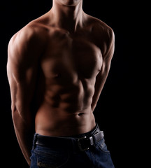 Fototapeta premium Muscular man showing his muscular body