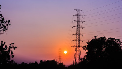 high voltage tower in sunset background