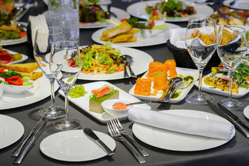 Food and sushi on plates in the restaurant