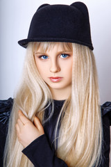 Cute girl teenage with long blond hair posing studio nature portrait.