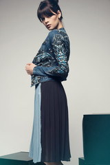 Model in a stylish skirt and jacket 