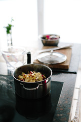 Cooking red cabbage with apples in kitchen