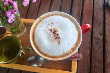 cup of coffee on wood table