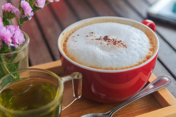 cup of coffee on wood table