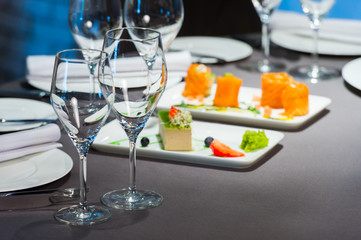 Wine glasses on the table in the restaurant, selective focus