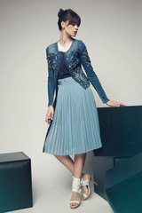 Model in a stylish skirt and jacket 