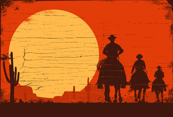 Silhouette of three cowboys riding horses on a wooden board