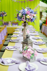 holiday table with a vase from fresh flowers