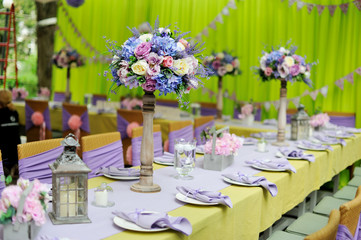 holiday table with a vase from fresh flowers