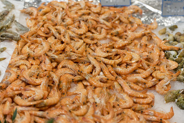 Seafood at a market, fresh shrimps on the ice