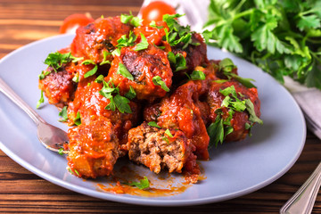Traditional Italian beef meatballs, tomato sauce and parsley