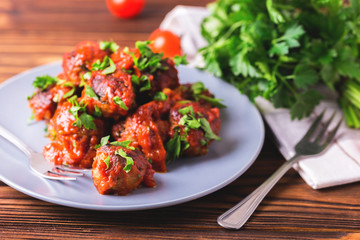 Traditional Italian beef meatballs, tomato sauce and parsley