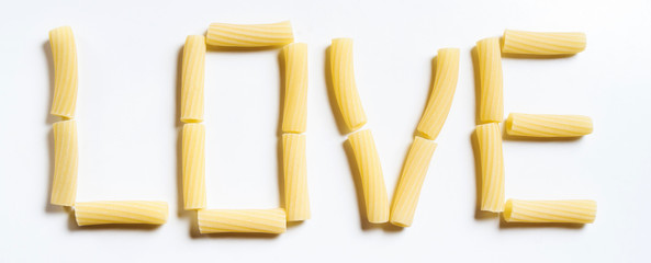 Word LOVE made of rigatoni italian pasta