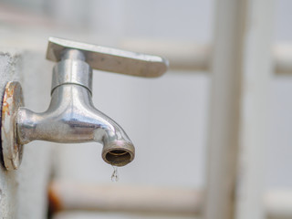 Close up old and grunge faucet and water drop, Water shortage concept.