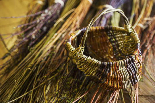 Close up of basket and willow bundles in a basket weaver's workshop.