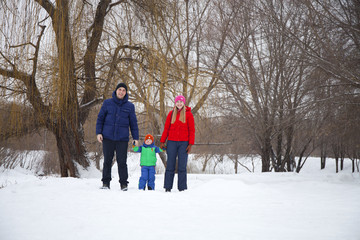 Fototapeta na wymiar happy young family spending time outdoor in winter