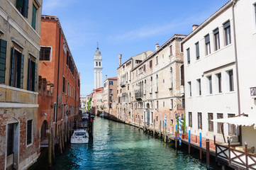 Obraz na płótnie Canvas Beautiful venetian street in summer day, Italy