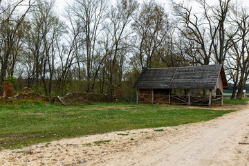 Old wooden barn with haystacks