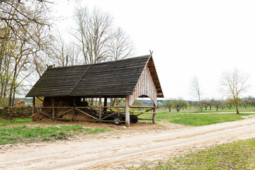 Fototapeta na wymiar Dry hay in wooden barn house interior
