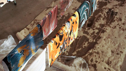 Marbled paper prints drying