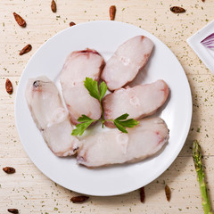 slices of raw monkfish