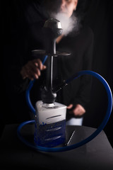 Man smokes fruit hookah