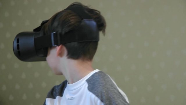 Little boy wearing vitrual reality headset