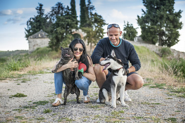 Naklejka na ściany i meble Couple of boyfriends with his dog