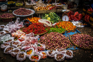 Various kind of spices with beautiful colour on sale on the ground at traditional market photo...