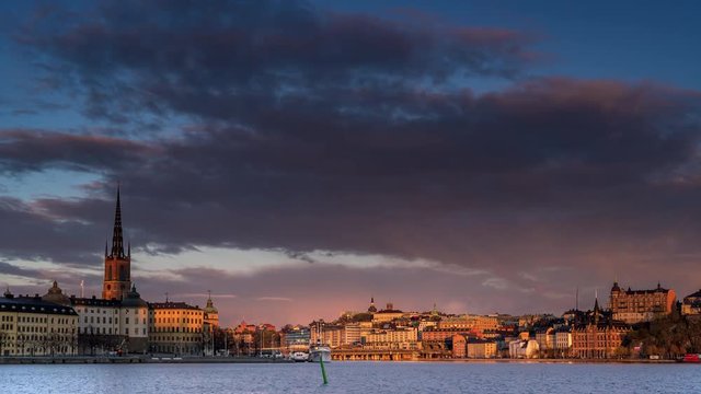 Time lapse of central Stockholm with an old steamboat passing by island Riddarholmen.