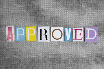 approved word on grey background