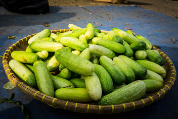 Pile of cucumber on bamboo webbing on sale at traditional market photo taken in Bogor Indonesia