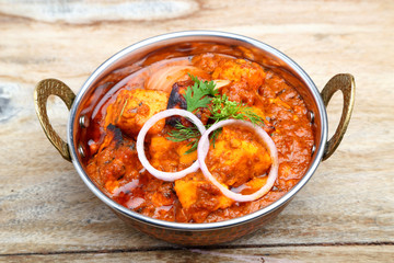 Indian Food or Indian Curry in a copper brass serving bowl.