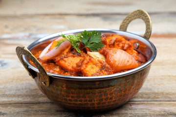 Indian Food or Indian Curry in a copper brass serving bowl.