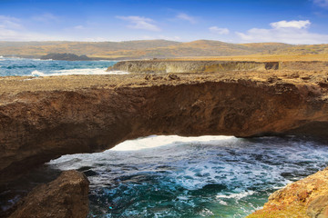 Natural bridge at the Caribbean sea in Aruba
