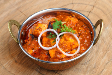 Indian Food or Indian Curry in a copper brass serving bowl.