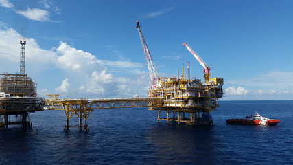 Supply boat transfer cargo to oil and gas industry and moving cargo from the boat to the platform