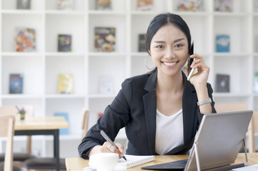 A business woman working on the laptop at the office