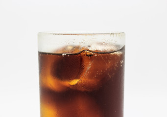 Fresh cola in glass on white background.