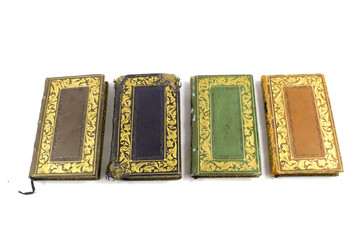 Miniature Antique Books on White Background