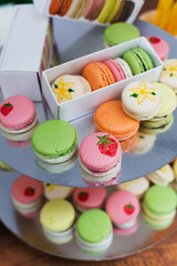 Colorful macaron cookies on bar for sale
