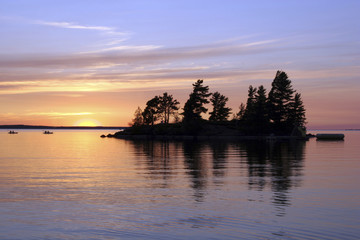 Dramatic cloudy sunset over calm Lake Nipissing, Canada.