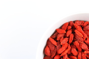 dried goji berries in a small white bowl
