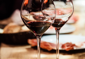 Red wine and snacks. Shallow depth of field.